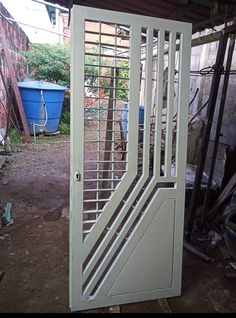 an open door in the side of a building with metal bars on it's sides