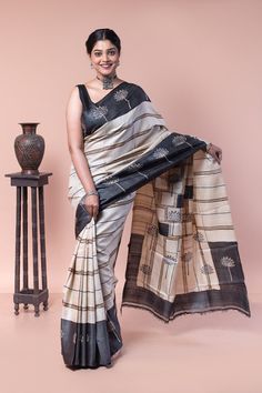 Exclusive black color Tussar saree with floral hand block printed motifs on the aanchal and the border. Minimalistic yet bold pattern perfect for both formal wear as well as celebration wear. COLOUR: Black and white CRAFT: Hand block printing DIMENSIONS: Saree length 6.5 Mts., Saree width 1.14 Mts. Blouse piece inclusive. NET QUANTITY: 1 pc saree PATTERN: Floral hand block printed PRODUCT MATERIAL: Handwoven Gachi Tussar saree PRODUCT TYPE: Saree with Blouse piece WEIGHT: 450 g WASH INSTRUCTIONS: Dry cleaning is recommended for this product. Iron inside out. Do not bleach and expose this product to excessive heat and sunlight for long. Saree Pattern, Tussar Saree, Saree For Women, Tussar Silk Saree, Saree Look, Block Printing, Beautiful Saree, Pattern Floral, Earthy Tones