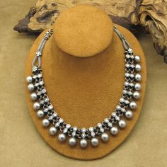 This vintage necklace is a stunning piece of handcrafted jewelry that is sure to catch the eye of anyone who sees it. Made from high-quality sterling silver, this necklace boasts an intricate beaded design that is both unique and timeless. The necklace measures 18 1/4" from end to end. The beads measure 11mm tall by 11mm wide. The artist's hallmark (RA) is stamped on the necklace. This necklace is perfect for anyone who loves vintage and antique jewelry. The silver color and unique design make i Handmade Beaded Necklace, Antique Jewelry Necklace, Handmade Beaded Necklaces, Tucson, Vintage Watches, Vintage Necklace, Vintage Sterling Silver, Handcrafted Jewelry, Antique Jewelry