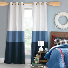 a living room with blue and white curtains