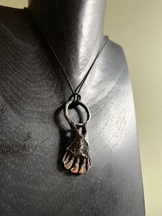 "This lost wax cast sterling silver chthonic talisman is almost 1\" wide and 2\" long. It hangs on a leather cord." Wax Casting Jewelry, Lost Wax Casting Jewelry, Wax Casting, Casting Jewelry, Lost Wax Casting, Lost Wax, Leather Cord, Pendant Necklaces, Jewelry Necklace Pendant