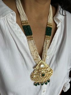 All our pieces are in stock and will be dispatched within 24 to 48 hours of order. Orders received during the weekend will be dispatched on Monday The white and green beads strings on both sides of an elegant Kundan pendant make it a statement wedding necklace. One of our favorite picks for the wedding season 2022❤️ The drop length of the necklace: is approximately 11 inches, and comes with an adjustable string. Length of Earrings: 2 inches Ornate Pendant Jewelry For Wedding, White Traditional Kundan Necklace For Jewelry Making, White Temple Jewelry Necklaces For Jewelry Making, White Temple Jewelry Necklaces, Fusion Style Long Necklace For Wedding, Fusion Style Long Wedding Necklaces, Handmade White Kundan Beaded Necklaces, Handmade White Kundan Beaded Necklace, White Kundan Jewelry For Jewelry Making