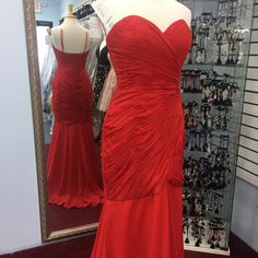 Red Dress Fit And Flair Fitted Red Dress With Ruched Bodice, Red Dress With Ruched Bodice For Gala, Red Gala Dress With Ruched Bodice, Red Cocktail Evening Dress With Ruched Bodice, Elegant Red Ruched Gown, Red Sleeveless Maxi Dress With Ruched Bodice, Red Fitted Bodice Dress For Prom Season, Red Evening Dress With Ruched Bodice For Prom, Red Dresses With Fitted Bodice For Prom