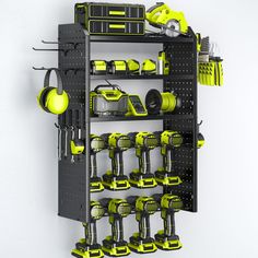 there is a large rack with many tools on it and some yellow items hanging from the wall