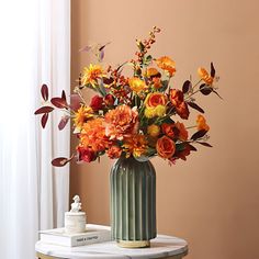 a vase filled with flowers sitting on top of a table