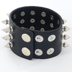 Metal Studded Wristband. A timeless classic that everyone needs in their wardrobe - the studded black leather heavy metal wristband - enough said! Adjustable clasp closure. Dimensions: Width: 4.2cm (1.7") Length: 21.5cm (8.5") Adjustable Punk Wristband With Spikes, Adjustable Black Spiked Wristband, Punk Black Wristband With Spikes, Adjustable Studded Leather Punk Bracelet, Gothic Black Studded Leather Bracelet, Angel Dress, Timeless Classic, Womens Maxi Dresses, Black Lace