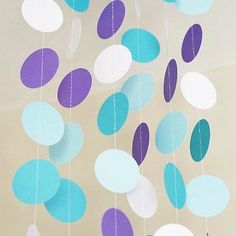 some paper circles hanging from the ceiling