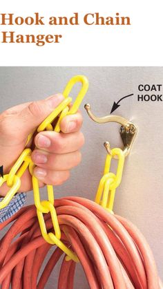 a person is holding a yellow chain with red hoses attached to it and the words hook and chain hanger above them