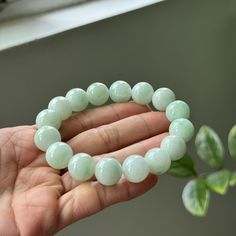 Description --------------------------------- The jade bead bracelet is 100% natural, untreated and undyed Type-A jadeite jade and is 100% handmade. Arranging translucent sweet faint green beads, purely created by our Mother Nature makes this bracelet unique and beautiful. The sense of touch is cool. It fits average size and expands with elastic. But this bracelet has about 7 inches in length. Wearing a jadeite bead bracelet symbolizes to have a peaceful life and keep you from evil spirits. It a Handmade Round Jade Stretch Bracelet, Jade Gemstone Beaded Bracelets, Aventurine Crystal Bracelet With Gemstone Beads, Jade Beaded Bracelets For Healing, Jade Stretch Bracelet For Healing With Round Beads, Round Jade Beaded Bracelets With Gemstone Beads, Jade Stretch Bracelet With Gemstone Beads, Elegant Round Jade Stretch Bracelet, Aventurine Gemstone Beads Bracelets