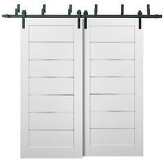 two white doors with black bars on each side