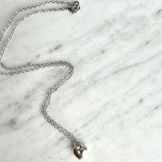 Freya meaning: For a noblewoman A classic sterling plated chain and solid heart charm with a nice weight to the touch. Measures: 16" Ethiopia, Heart Charm, Plating, Chain, Silver