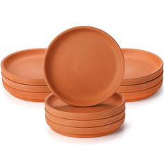 six orange plates stacked on top of each other