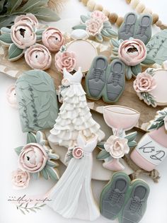 wedding cookies decorated with flowers and shoes