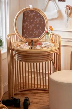 a round wooden table with a mirror on it