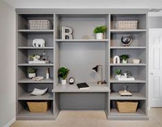 a room filled with lots of gray shelves