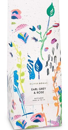 a white box with colorful flowers and leaves on the front, it's packaging is shown