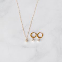 This exquisite handcrafted pearl necklace and huggie hoops gift set are a timeless fusion of elegance and style.  The necklace features a lustrous pearl delicately hanging on a chain, creating a classic yet modern look. Paired with my sleek Huggie diamond cz hoops adorned with subtle detailing, this set is the perfect balance of sophistication and versatility.  Elevate any outfit with this thoughtful and beautifully crafted ensemble, making it an ideal gift for those who appreciate the finer things in life. THE DETAILS:💜  14K Gold-filled Necklace & 14k Gold-Filled Hoops  14, 15, 16, 18, or 20 inches.  (14= small choker, 15= large choker, 16= collarbone, 18= standard, 20= long) Heavily Gold Plated Brass CZ Bee charm size 8mm (25mm=1 inch) Cubic Zirconia Stones  Option to be adjustable with Fine Jewelry Pearl Charm Pendant, Fine Jewelry With White Pearl Charm, White Pearl Charm Fine Jewelry, Fine Jewelry White Pearl Charm, Fine White Jewelry With Pearl Charm, Dangle Jewelry With Pearl Charm For Anniversary, Everyday Pearl Dangle Jewelry, White Gold Dangle Earrings With Pearl Charm, Anniversary Pearl Charm Dangle Jewelry