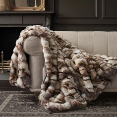 a couch with a blanket on top of it