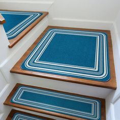 blue rugs on the stairs in a house