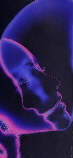 a man's head is lit up in blue and pink light, with his eyes closed