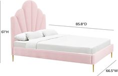 a bed with a pink headboard and foot board, measurements for the size of the bed