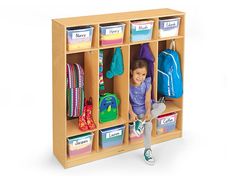 a child's wooden locker with several bins