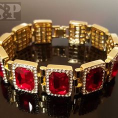 Hip Hop Celebrity Rick Ross Red Ruby Cz Bracelet 14k Gold Plating For A Premium Quality Finish That Will Turn Heads. 18mm Width And 8.5" Length. Luxury Clasp To Lock Your Bracelet Easily And Securely. Celebrity Style High Quality & Polished. Top Quality Cz Stones Red Sparkly Jewelry For Formal Occasions, Red Bracelets With Diamond Accents, Red Round Bracelets With Diamond Accents, Iced Out Bracelet Jewelry For Anniversary, Gold Cz Tennis Bracelet For Valentine's Day, Gold Cubic Zirconia Tennis Bracelet For Valentine's Day, Red Diamond Jubilee Bracelet Gift, Formal Red Diamond Bracelet, Luxury Red Diamond Bracelet For Anniversary