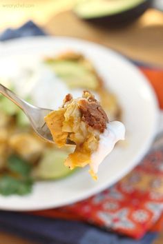 a close up of a spoon with food on it