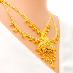 This 22k gold light patta set features a traditional festive tasseled design, perfect for adding elegance to any outfit. Weighing 55.0 grams, it showcases a yellow gold finish that enhances its intricate and celebratory appearance. The set has a length of 24 inches with a 2.5-inch drop and includes adjustable 1.5-inch links for a comfortable fit. Secured with a hook lock, it combines style and practicality. The matching earrings, each 2.2 inches long, feature screw back posts for added security. Festive Yellow Temple Necklace, Gold Temple Necklace With Tilla For Eid, Elegant Yellow Gold Temple Necklace With Pallu, Gold Zari Weaving Jewelry For Weddings, Elegant Gold Temple Necklace With Latkans, Festive Yellow Gold Temple Necklace With Latkans, Gold Wedding Jewelry With Zari Weaving, Elegant Yellow Temple Necklace For Festive Season, Festive Gold Jewelry With Zari Weaving