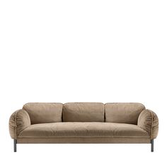 a beige couch sitting on top of a white floor