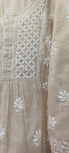 Interestingly, this famous craft is famous across India and all around the world and is delightfully worn by people. One of the most prominent features of the Lucknow's Chikankari work is the stitches. This Chikankari kurta set is handcrafted by women to give them recognition in society. Luxury Chikankari Embroidery Designer Blouse, Luxury Chikankari Embroidery Fabric For Diwali, Luxury Traditional Scarves With Chikankari Embroidery, Luxury Chikankari Embroidery Kurta, Traditional Anarkali Set With Intricate Embroidery For Summer, Luxury Elegant Tunic With Chikankari Embroidery, Traditional Embroidered Beige Anarkali Set, Bohemian Cream Kurta For Festivals, Beige Cutdana Kurta For Festivals