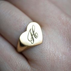 The heart signet ring is a classic, and this one is personalized with an inset monogram. This item is engravable with text or monogram of your choice at no extra cost. The initals are engraved onto the ring and embedded in the 3D model for a flawless embossed finish. You may choose to customize this ring with different images, letters or words. A render of your custom design will be sent to you before production. A gemstone on this ring is also possible, please inquire for pricing details and op Classic Heart-shaped Signet Ring For Wedding, Classic Heart Ring For Valentine's Day, Classic Heart-shaped 14k Gold Signet Ring, Classic Heart Shaped 14k Gold Signet Ring, Classic 14k Gold Heart-shaped Signet Ring, Classic Heart-shaped Sterling Silver Engraved Ring, Classic Heart-shaped Engraved Sterling Silver Ring, Classic Sterling Silver Heart-shaped Engraved Ring, Minimalist Engraved Ring With Initials For Anniversary