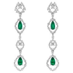 Regalia Collection - This collection is an ode to the magnificence which adorns the outfits of royals and evening gowns of Hollywood celebrities. Featuring the finest Colombian and Zambian emeralds with diamonds, this collection is timeless and can pass through generations. Designer emerald earrings in 18K white gold with diamonds. Emerald: 2.31 carat pear shape - 4 pieces. Origin: Colombia. Diamonds: 3.941 carat, G colour, VS clarity. Gold: 10.07g, 18K white gold. EM59 Elegant Platinum Diamond Earrings For Formal Occasions, Elegant Platinum Earrings For Evening, Elegant Evening Platinum Earrings, Exquisite Diamond Earrings For Formal Occasions, Elegant Hand Set Bridal Earrings For Formal Occasions, Elegant Hand-set Bridal Earrings For Formal Occasions, Formal Platinum Diamond Earrings With Elegant Design, Elegant Diamond Earrings For Formal Occasions, Elegant Platinum Bridal Earrings