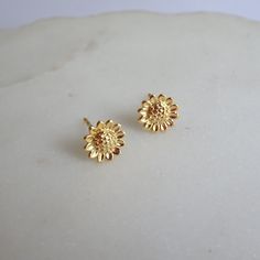 Description: *  925 sterling silver - all components, *  24 k gold plated - all components, *  size 8 mm diameter, *  sunflower studs come with sterling silver gold plated backs, *  high quality, *  earrings will be sent in a jewellery gift box. You can visit my shop for more designs, please click: https://meloujewellery.etsy.com Free shipping will be provided to the UK customers. Please note, no tracking number will be available with that method. On average it takes 2 to 3 working days to be de Yellow Gold Flower Earrings As Gift, Yellow Gold Flower Earrings For Gift, Dainty Yellow Gold Flower Earrings For Gifts, Delicate Gold Flower Earrings In Sterling Silver, Everyday Yellow Gold Flower-shaped Jewelry, Yellow Gold Flower Jewelry For Everyday, Everyday Yellow Gold Flower Jewelry, Yellow Gold Hallmarked Flower Earrings For Gift, Handmade Gold Flower Earrings In Sterling Silver