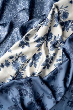 blue and white fabric with flowers on the top, as if it were made from silk