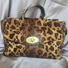 Velvety Smooth Janie Bryant Leopard Print Handbag With Large Front Pocket. Gold Polished Hardware And Black Patent Leather Handles. One Gold Chained/Patent Leather Shoulder Strap. Interior Slip Pockets And Zipper Pocket. Never Used. Leopard Print Accessories, Fur Bags, Leopard Print Handbags, Leopard Handbag, Leopard Print Bag, Leather Tote Bag Women, Dooney & Bourke Bag, Animal Fur, Fur Bag