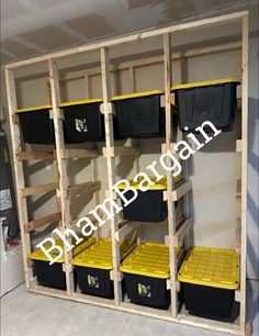 the shelves are filled with yellow and black bins