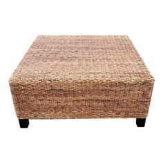 a brown wicker ottoman with black legs and footrests on an isolated white background