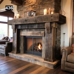 a living room with a fire place next to a couch and chair in front of the fireplace