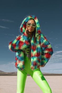 Add a burst of color to your festival wardrobe with our Multicolor Neon Faux Fur Hooded Festival Jacket. This vibrant jacket features a blend of neon colors that will make you stand out in any crowd. The cozy hood and soft faux fur provide warmth and comfort, perfect for those chilly festival nights. Whether you're at Burning Man, Coachella, or any rave event, this jacket is designed to turn heads and make a bold fashion statement. Pair it with your favorite festival outfits for an unforgettable look. Key Features: *Vibrant multicolor neon design *Soft and luxurious faux fur *Cozy hood for added warmth and style *Perfect for festivals, raves, and other events *High-quality materials for comfort and durability Fabric & Care: *Made from high-quality faux fur *Hand wash cold, line dry *Do not Fall Rave Outerwear With Long Sleeves, Rave Long Sleeve Outerwear For Fall, Fall Rave Long Sleeve Outerwear, Funky Multicolor Winter Outerwear, Trendy Multicolor Festival Outerwear, Trendy Multicolor Outerwear For Festivals, Trendy Winter Festival Outerwear, Rainbow Long Sleeve Winter Outerwear, Trendy Hooded Outerwear For Party