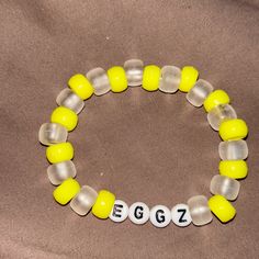 This Bracelet Is Made With Yellow And Frosty Clear Pony Beads. This Is A Funny Bracelet To Show Your Friends Personalized Yellow Stretch Bracelet As Gift, Trendy Yellow Beads For Gifts, Personalized Yellow Casual Bracelet, Casual Yellow Personalized Bracelet, Personalized Adjustable Yellow Beaded Bracelets, Personalized Yellow Bracelets With Round Beads, Yellow Jewelry With Letter Beads For Gift, Casual Hypoallergenic Yellow Jewelry, Casual Yellow Hypoallergenic Jewelry