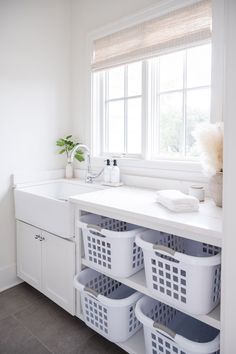 the laundry room is clean and ready to be used as a storage area for clothes