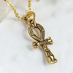 "Gold Ankh Necklace, Egyptian cross Jewelry, eternal life Symbol of Life Layering Necklace, Personalized Initial Charm, Mother's day gift Listing is for the solo Ankh charm necklace on a gold chain. You can personalize this necklace, by: ADDING initial charms here: https://etsy.me/2ZypsB3 ADDING Swarovski birthstones here: https://etsy.me/356yFBC Cross is 7/8\" long, it's a delicate small cross necklace. The Ankh cross was a very powerful Ancient Egyptian symbol for eternal life and good health. Nickel-free Gold Cross Necklace, Symbolic Jewelry: Cross Pendant Charms, Symbolic Cross Charms Jewelry, Gold Cross Necklace With Nickel-free Cross Pendant, Spiritual Cross Pendant Jewelry With Charms, Symbolic Handmade Cross Pendant Necklace, Handmade Symbolic Cross Pendant Necklace, Spiritual Crucifix Charm Necklace, Spiritual Crucifix Cross Necklace For Anniversary