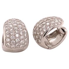 Elegant and classic diamond clip-on earrings crafted in 18K white gold. Two pavé set beds with a total of 86 brilliant-cut diamonds together weighing 1.72 carats . The diamonds are of G/H colour and si clarity. A must have in every modern jewellery collection. dimensions approx.: 18 x 12 mm / 0.71 x 0.47 inches Maker’s mark: HPD Assay mark: 750 Luxury Fine Jewelry Hallmarked Clip-on Earrings, Luxury Clip-on Round Diamond Earrings, Luxury Diamond Round Clip-on Earrings, Baguette Diamond Earrings, Pave Diamond Earrings, 18k Gold Earrings, Miriam Haskell, Gold Diamond Earrings, Earring Crafts