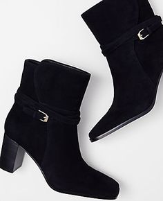 Step into sophistication with the Ann Taylor Wraparound Buckle High Block Heel Suede Boots, a perfect blend of style and comfort designed for the modern woman. 

- Size: 5 1/2
- Color: Black
- Material: Suede
- Gender: Female
- Heel Height: 2 3/4 inches
- Shaft Circumference: 5 1/4 inches
- Features: Pointy toe, adjustable buckle at side ankle, padded footbed

These boots are crafted from luxurious suede and feature a chic pointy toe and a striking block heel that elevates any outfit. The adjust Fall Suede Ankle Strap Heels, Fall Suede Heels With Ankle Strap, Suede Ankle Strap Heels For Fall, Heeled Boots With Buckle Ankle Strap, Fall Heeled Boots With Buckle Closure Medium Width, Fall Heeled Boots With Buckle Closure, Fall Medium Width Heeled Boots With Buckle, Ankle Strap Boots With Buckle Closure For Work, Buckle Closure Ankle Boots For Work