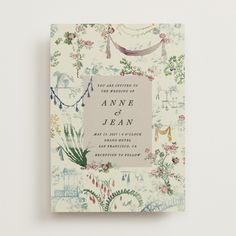 the wedding card is decorated with flowers and garlands, including an ornament