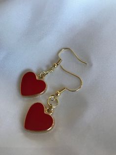 "FIRST TIME DISCOUNT: USE CODE FIRSTTIME20 FOR 20% YOUR FIRST ORDER! ♡ ALL PACKAGING IS 100% RECYCLABLE, BIODEGRADABLE, OR MADE FROM 100% RECYCLABLE MATERIALS ♡ These super cute gold heart dangling earrings are a perfect accessory to your already gorgeous ears! ALL ORDERS NOW COME WITH A GIFT BOX! Listing comes with two earrings (aka: one pair)! Dimensions: heart: 17mm entire earring: around 1.5\" (one and a half inches) long Materials: hook: 14kt Gold Plated 14kt Gold Filled ALL PACKAGING IS 10 Gold Heart Jewelry, Gold Heart Earrings, Red Heart Earrings, Gold Heart Earring, Red Jewelry, Classy Jewelry, Jewelry Lookbook, Earrings Red, Red Earrings