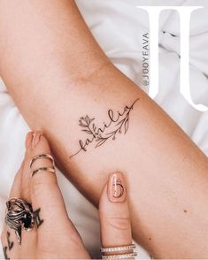 a woman's legs with tattoos on the cover of an issue of u magazine