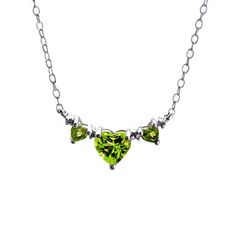 Perfect for the August princess, this triple-heart necklace is certain to make her birthday - or any day - a special one. Fashioned in sleek sterling silver, three heart-shaped spring-green peridots sparkle in a neat row, separated only by shimmering diamond accents. Polished to a brilliant shine, this 18.0-inch cable chain necklace secures with a spring-ring clasp. Silver Heart Cut Necklace For May Birthstone, Green Sterling Silver Heart Pendant Necklace, Green Heart-shaped Sterling Silver Necklace, Green Sterling Silver Necklace With Heart Charm, Green Heart Pendant Necklace For Mother's Day, Silver Diamond Necklace, Peridot Jewelry, Silver Necklaces Women, Cable Chain Necklace