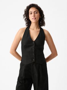 Soft linen-cotton vest.  Halter neckline.  Sleeveless.  Button front.  Welt pockets at front.  Smocked back.  * Fit: Slightly fitted.  Sits close to the body.  Hits at the hip.  Models wearing Gap Halter Vest, Keeping Up Appearances, Cotton Vest, Pirate Costume, Wedding Officiant, Black Vest, Halter Neckline, Soft Hand, Halloween Ideas